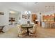Open dining room with a breakfast bar and a view of the kitchen at 346 Treviso Dr, Kissimmee, FL 34759
