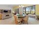 Bright dining room with large glass windows and a view of the patio at 346 Treviso Dr, Kissimmee, FL 34759