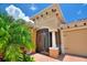 Inviting home exterior with a screened porch, decorative columns and brick pavers at 346 Treviso Dr, Kissimmee, FL 34759