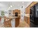 Open kitchen with a large island, granite countertops, and stainless steel appliances at 346 Treviso Dr, Kissimmee, FL 34759