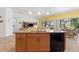 Bright kitchen with an island, plenty of counter space and views of the backyard at 346 Treviso Dr, Kissimmee, FL 34759