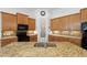 Spacious kitchen with a large island, granite countertops and stainless steel appliances at 346 Treviso Dr, Kissimmee, FL 34759