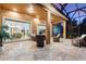 Open-concept screened lanai with comfortable seating and access to both the kitchen and living room at 346 Treviso Dr, Kissimmee, FL 34759