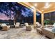Screened lanai featuring tile flooring, comfortable seating, and scenic view of the outdoors at 346 Treviso Dr, Kissimmee, FL 34759