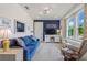 Cozy living room features a comfortable sofa, armchair, and bright window, creating a welcoming atmosphere at 346 Treviso Dr, Kissimmee, FL 34759