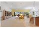 Open living space with a ceiling fan, large windows and casual dining area at 346 Treviso Dr, Kissimmee, FL 34759