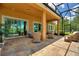 The screened patio features comfortable seating and views of the surrounding landscape for relaxation and enjoyment at 346 Treviso Dr, Kissimmee, FL 34759