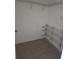 Walk-in closet featuring tile floors and adjustable wire shelving units for storage at 3502 Windy Walk Way # 2-208, Orlando, FL 32837