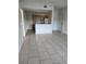 Open living space featuring tile floors with an open concept to the kitchen at 3502 Windy Walk Way # 2-208, Orlando, FL 32837
