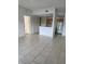 Open living space featuring tile floors with an open concept to the kitchen at 3502 Windy Walk Way # 2-208, Orlando, FL 32837