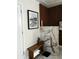 Bright bathroom with a marble vanity, wooden accents, and a framed print of a vintage swimming pool at 3715 Sarasota Ct, Orlando, FL 32812