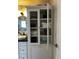 Built-in bathroom storage with glass door cabinet, shelving and vanity at 3715 Sarasota Ct, Orlando, FL 32812