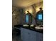 Beautiful bathroom vanity with vessel sinks, modern lighting, and marble accents at 3715 Sarasota Ct, Orlando, FL 32812