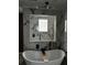 Freestanding bathtub with modern fixtures and marble surround at 3715 Sarasota Ct, Orlando, FL 32812