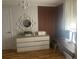 Bright bedroom featuring a modern dresser and desk setup with a mirror at 3715 Sarasota Ct, Orlando, FL 32812
