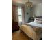 Bedroom with a neutral color palette, plush bedding, and a window offering ample natural light at 3715 Sarasota Ct, Orlando, FL 32812