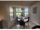 Cozy dining area with bay windows and a modern chandelier at 3715 Sarasota Ct, Orlando, FL 32812