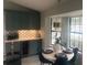 Dining area with wine refrigerator, accent lighting and a modern chandelier at 3715 Sarasota Ct, Orlando, FL 32812