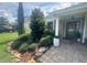 Landscaped front entrance featuring a brick walkway leading to the front door with a lovely stone garden at 3715 Sarasota Ct, Orlando, FL 32812