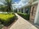 Single-story house with verdant landscaping and a brick walkway to the front door at 3715 Sarasota Ct, Orlando, FL 32812