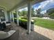 Inviting covered front porch with a seating area and a well-manicured lawn at 3715 Sarasota Ct, Orlando, FL 32812