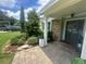 Home's covered front porch, with nice brickwork and landscaping at 3715 Sarasota Ct, Orlando, FL 32812