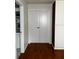 Hallway with closet, double doors, and wood flooring at 3715 Sarasota Ct, Orlando, FL 32812
