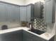 Stylish kitchen with grey cabinets, modern appliances, and geometric backsplash at 3715 Sarasota Ct, Orlando, FL 32812