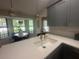 Bright kitchen with a large sink, quartz countertops, and bay window dining at 3715 Sarasota Ct, Orlando, FL 32812