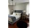 Bright main bedroom with chandelier, lamps, and hardwood floors at 3715 Sarasota Ct, Orlando, FL 32812