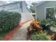 Picturesque pathway lined with vibrant plants and flowers, enhancing the property's curb appeal at 3715 Sarasota Ct, Orlando, FL 32812
