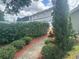 Charming walkway leading through lush landscaping and mature trees at 3715 Sarasota Ct, Orlando, FL 32812