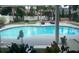 Lush backyard featuring a beautiful in-ground pool, pergola, and ample lounge seating at 3715 Sarasota Ct, Orlando, FL 32812