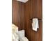 Elegant powder room featuring wood accent wall and stylish fixtures at 3715 Sarasota Ct, Orlando, FL 32812
