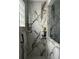 Luxurious shower with marble tiles, rainfall showerhead, and built in shelves at 3715 Sarasota Ct, Orlando, FL 32812