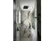 Contemporary shower with rainfall showerhead and marble tile at 3715 Sarasota Ct, Orlando, FL 32812