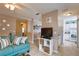 Open-concept living space with a comfortable sofa and view into kitchen at 4160 Pershing Pointe Pl # 1, Orlando, FL 32822