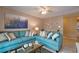 Cozy living room with a comfortable blue sofa and stylish decorative accents at 4160 Pershing Pointe Pl # 1, Orlando, FL 32822