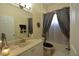 Bathroom featuring a vanity with a sink and a shower/tub combination with a curtain at 455 Cinnamon Dr, Kissimmee, FL 34759
