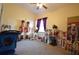 Bedroom with carpet, ceiling fan and window with red curtains at 455 Cinnamon Dr, Kissimmee, FL 34759
