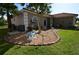 Charming single-story home featuring a well-manicured lawn and tasteful landscaping at 455 Cinnamon Dr, Kissimmee, FL 34759
