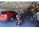 Garage featuring two cars, a motorcycle, a bicycle, and plenty of storage space at 455 Cinnamon Dr, Kissimmee, FL 34759