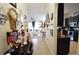 Inviting hallway leading to living spaces, adorned with decorative accents and artwork at 455 Cinnamon Dr, Kissimmee, FL 34759