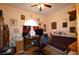 Office with a desk, computer monitors, a futon, and decorations on the walls at 455 Cinnamon Dr, Kissimmee, FL 34759