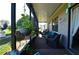 Relaxing screened-in porch furnished with comfortable seating and scenic views at 455 Cinnamon Dr, Kissimmee, FL 34759