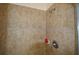 Tiled shower stall featuring a brushed nickel shower head and updated fixtures at 455 Cinnamon Dr, Kissimmee, FL 34759