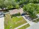 Spacious single-story home with a large, well-manicured lawn and mature trees at 4828 Jeanette Ct, St Cloud, FL 34771