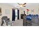 bedroom with fun dinosaur decor, comfortable chair, modern dresser, and ample light at 4828 Jeanette Ct, St Cloud, FL 34771