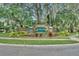 A well-maintained Ashley Oaks community sign surrounded by lush greenery at 4828 Jeanette Ct, St Cloud, FL 34771