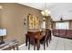 Dining area with chandelier and views to the living room at 4828 Jeanette Ct, St Cloud, FL 34771